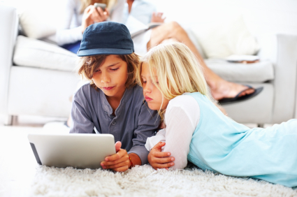tfwco.com digital life-this photo shows a young boy and girl at home using a tablet computer