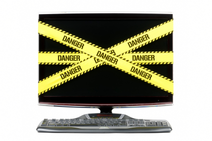 tfwco.com digital life-this image shows a computer monitor covered in black and yellow danger tape to represent dangers of online business world